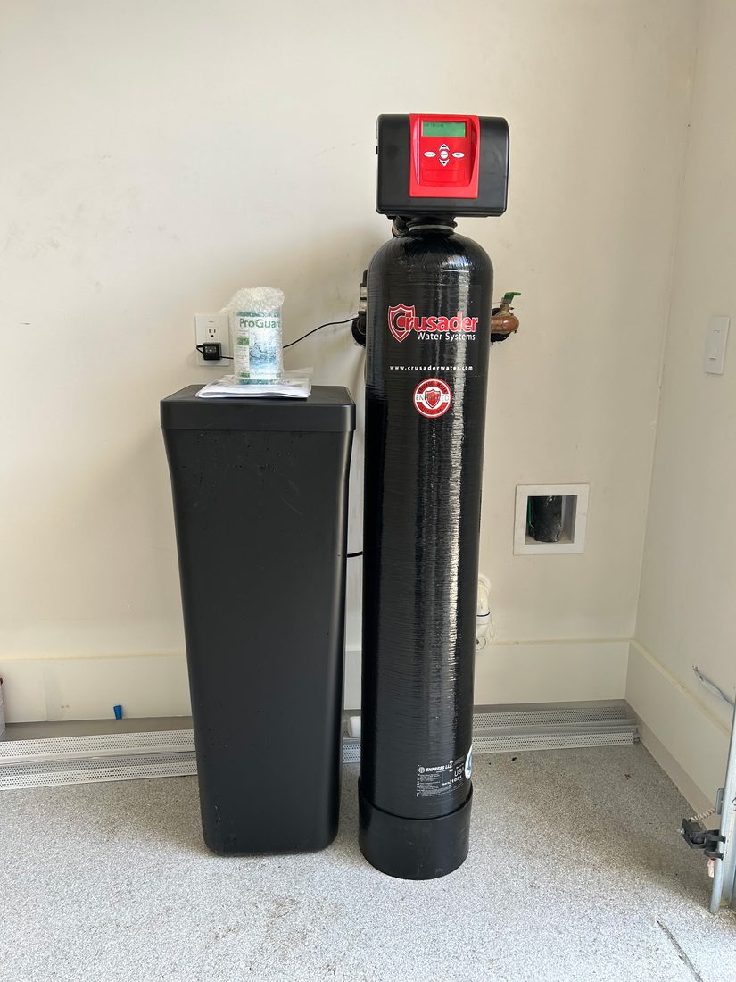 Crusader whole-home water system with owner&rsquo;s manual and ProGuard maintenance kit